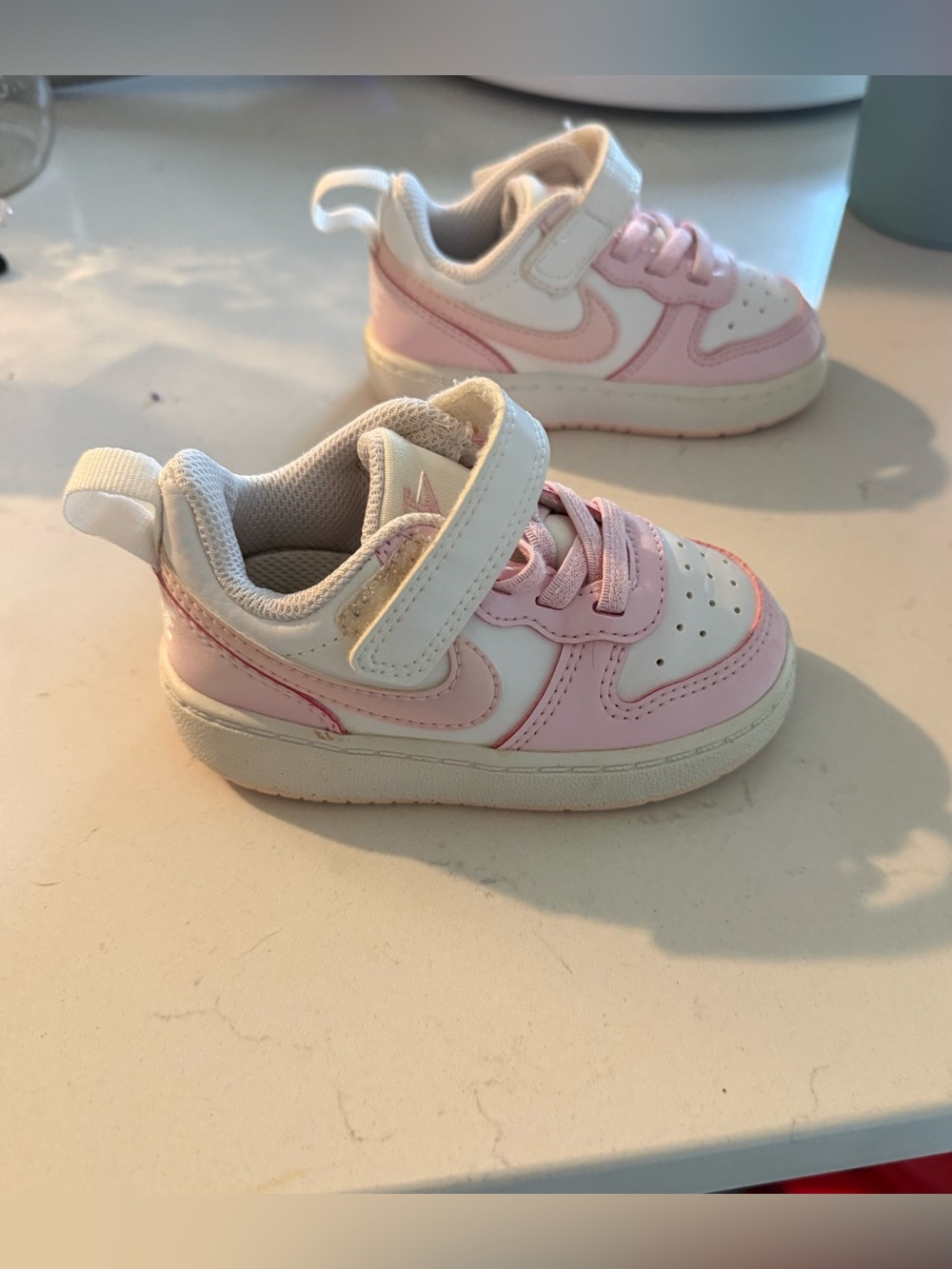 Nike Kids Low-Top Sneakers in White and Light Pink
